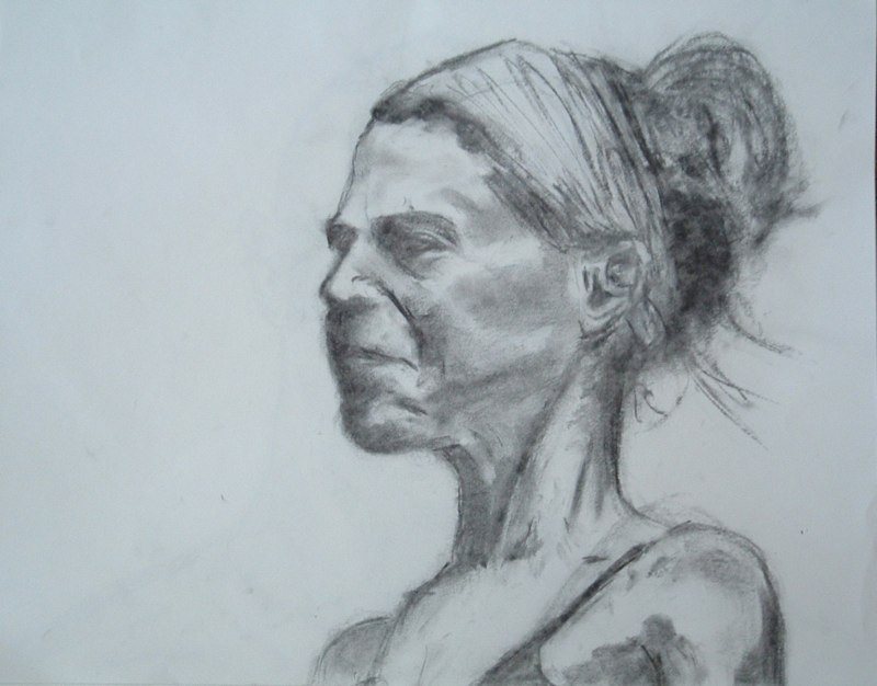 Charcoal portrait of a woman in profile